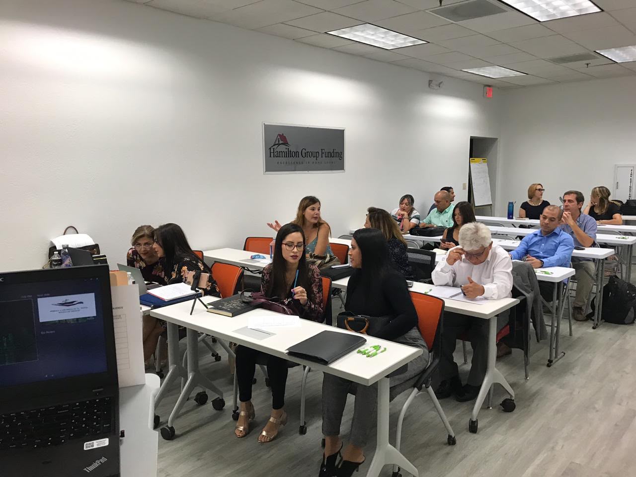 Asistentes durante una sesión en Hamilton Group Funding